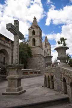 Cross in front of a cathedral Stock Photos