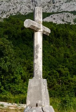 Cross in front of the mountain Stock Photos
