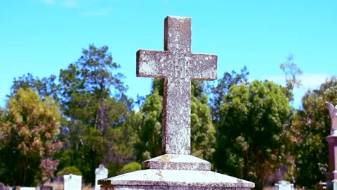 Cross Grave stone at a cemetery camera movement Stock Footage 146770454