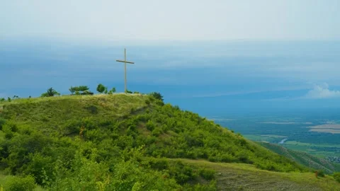 Cross on a green hill Stock Footage 314634541