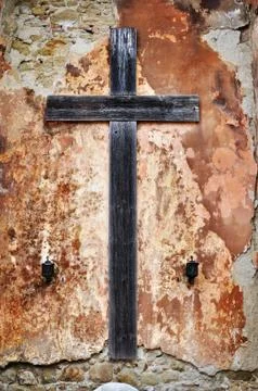 Cross on a grunge wall Stock Photos