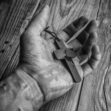 Cross in hand Stock Photos
