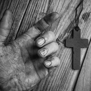 Cross in hand Stock Photos