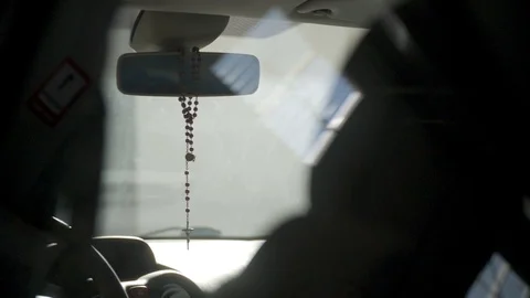 Cross Hanging From Rear-view Window Stock Footage 127036168