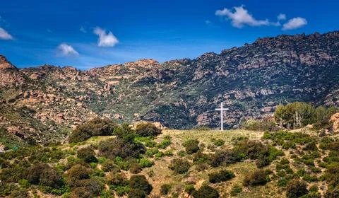 Cross on a hill in the mountains 스톡 사진