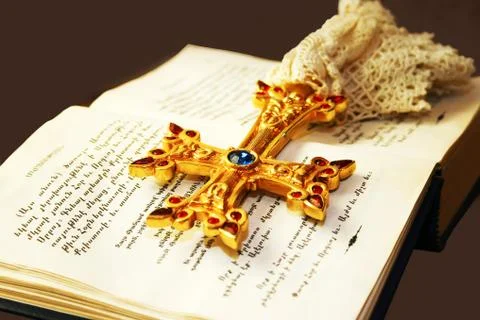 Cross on holy bible Stock Photos
