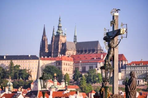 Cross with Jesus on Charles Bridge in Prague Stock Photos