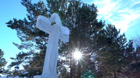 The cross with Jesus is located in the forest .	 Stock Footage 104768324