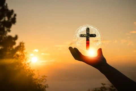 Cross of Jesus with network globe in human hands. Human hands open palm up .. Stock Photos