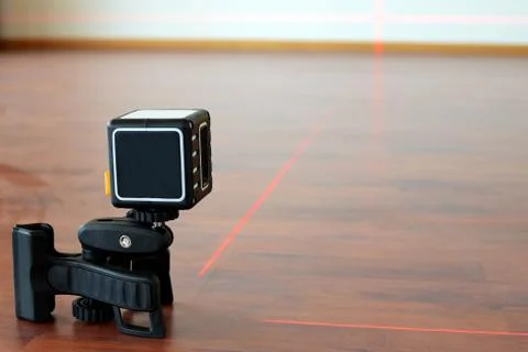 Cross-line laser on the floor Stock Photos
