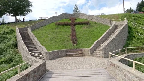 A cross made on the lawn Stock Footage 139945647