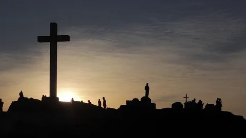 Cross monument silhouetted at sunset Stock Footage 71188468