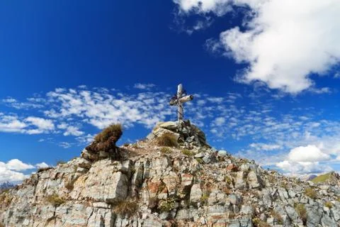 Cross on mountain peak Stock Photos