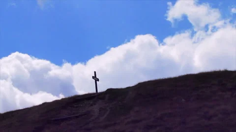 Cross in mountain - time laps clouds Stock Footage 28580128