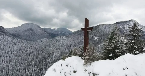 Cross On A Mountain Top Panning Winter Easter In Bicaz Mountains Romania Stock Footage 84998893