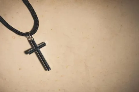 Cross on old paper Stock Photos