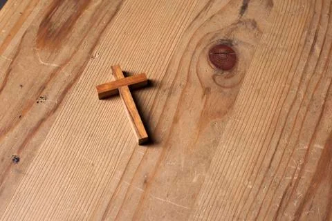 Cross over wood table with window light Stock Photos