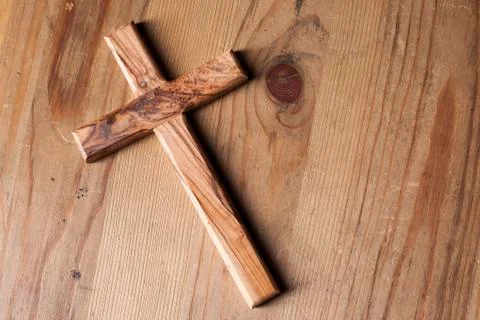Cross over wood table with window light Stock Photos