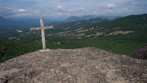 Cross overlooking Inaccessible Monastery Stock Footage 124146560