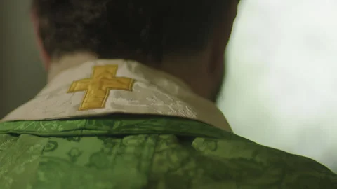 CROSS ON PRIESTS HABIT Stock Footage 141071200