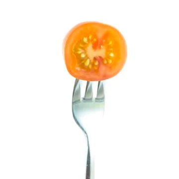 Cross red tomato sliced with fork Stock Photos