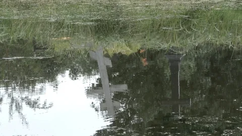 The cross is reflected in the water HD Stock Footage 79429284