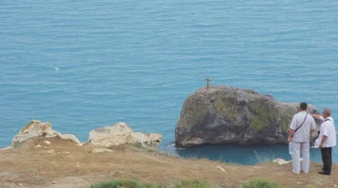 Cross on a rock in the sea Stock Footage 49671725