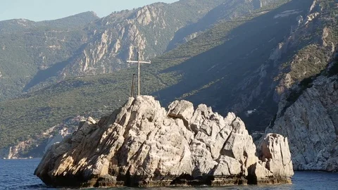 Cross on the rock in the sea Stock Footage 87474456