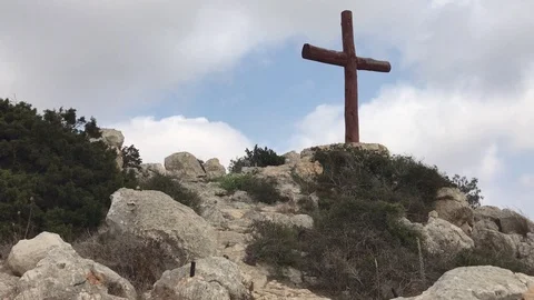 Cross on a Rocky Hill Against Cloudy Sky in Ayia Napa, Cyprus Stock Footage 101250641