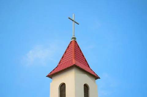 Cross on the roof of the Roman Catholic Church of the city of Yakutsk Stock Photos