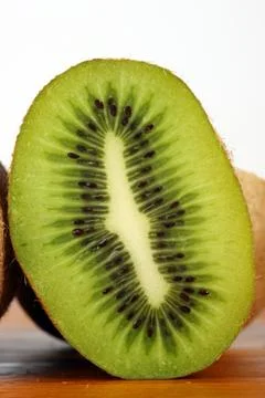 Cross section of kiwi Stock Photos
