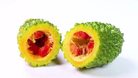 Cross section of ripe bitter melon, rotating Stock Footage 314201980