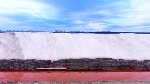 Cross section of salt pile and orange brine, Bulgaria Stock Footage 340405054