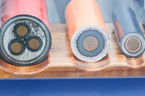 Cross section samples of high voltage electrical power cables. Industrial Stock Photos