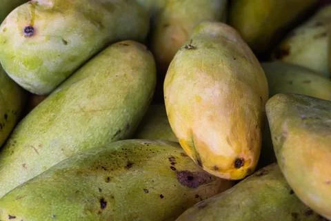 Cross Section Slice of Ripe Mango Showing Juicy Orange Flesh, Organic Tropi.. Stock Photos
