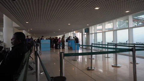 Cross section of tourist and passengers at an International Airport Stock Footage 108736769