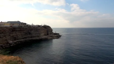 Cross on shore under sheer cliff  on Khersones peninsula. Stock Footage 105778152