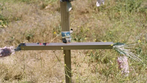 Cross On Side Of Highway 4K Stock Footage 127800812