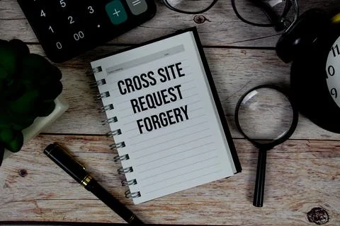 Cross Site Request Forgery (CSRF) text on notepad, Business and Financial c.. Stock Photos