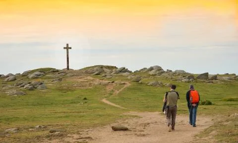 Cross in the sky at a sunset Stock Photos
