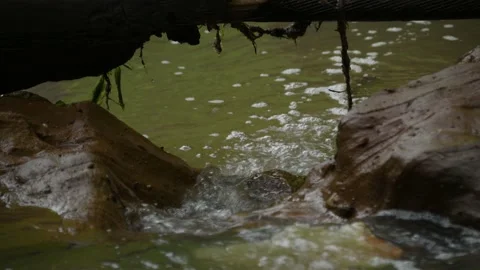 Cross the small mountain river on a mountain bike. The bike rides on the water Stock Footage 136362715