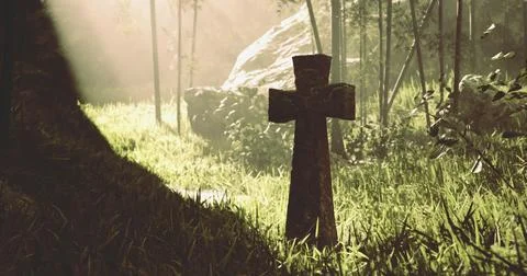 Cross standing in a grassy area surrounded by trees and sunlight Ilustración de archivo
