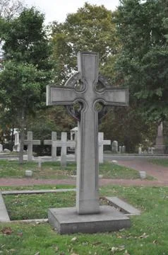 Cross Statue in a Cemetery Stock Photos