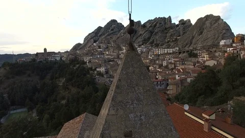 Cross on a steeple. A small town is visible in the distance. Italy, aerial drone Stock Footage 72203620