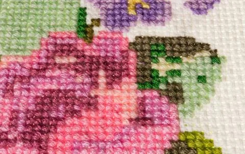 $cross-stitch made with colored threads for embroidery - mouline Stock Photos