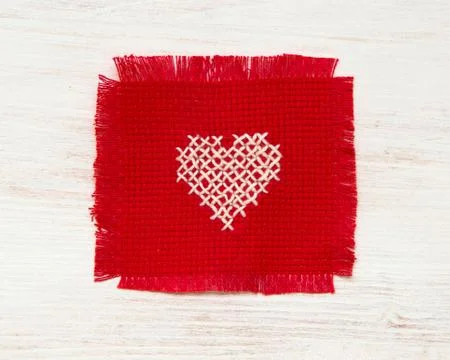 Cross stitched heart Stock Photos