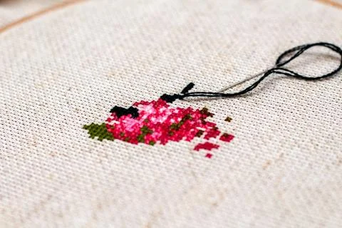 Cross stitching embroidery process. Needle embroidery frame threads. Hobby DI Stock Photos