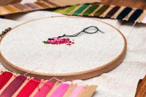 Cross stitching embroidery process. Needle embroidery frame threads. Hobby DI Stock Photos