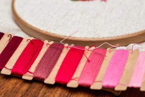 Cross stitching embroidery process. Needle embroidery frame threads. Hobby DI Stock Photos