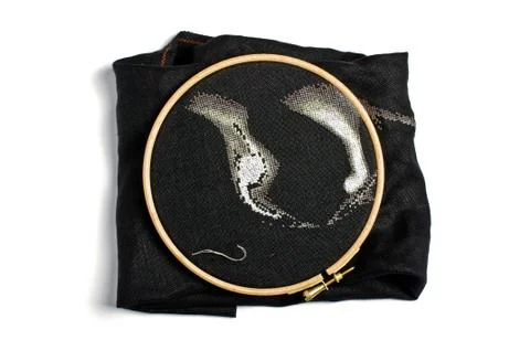 Cross stitching process close up Stock Photos